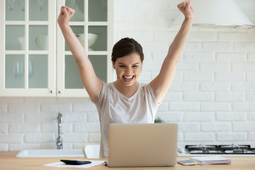 Female student is excited by email about perfect exam results